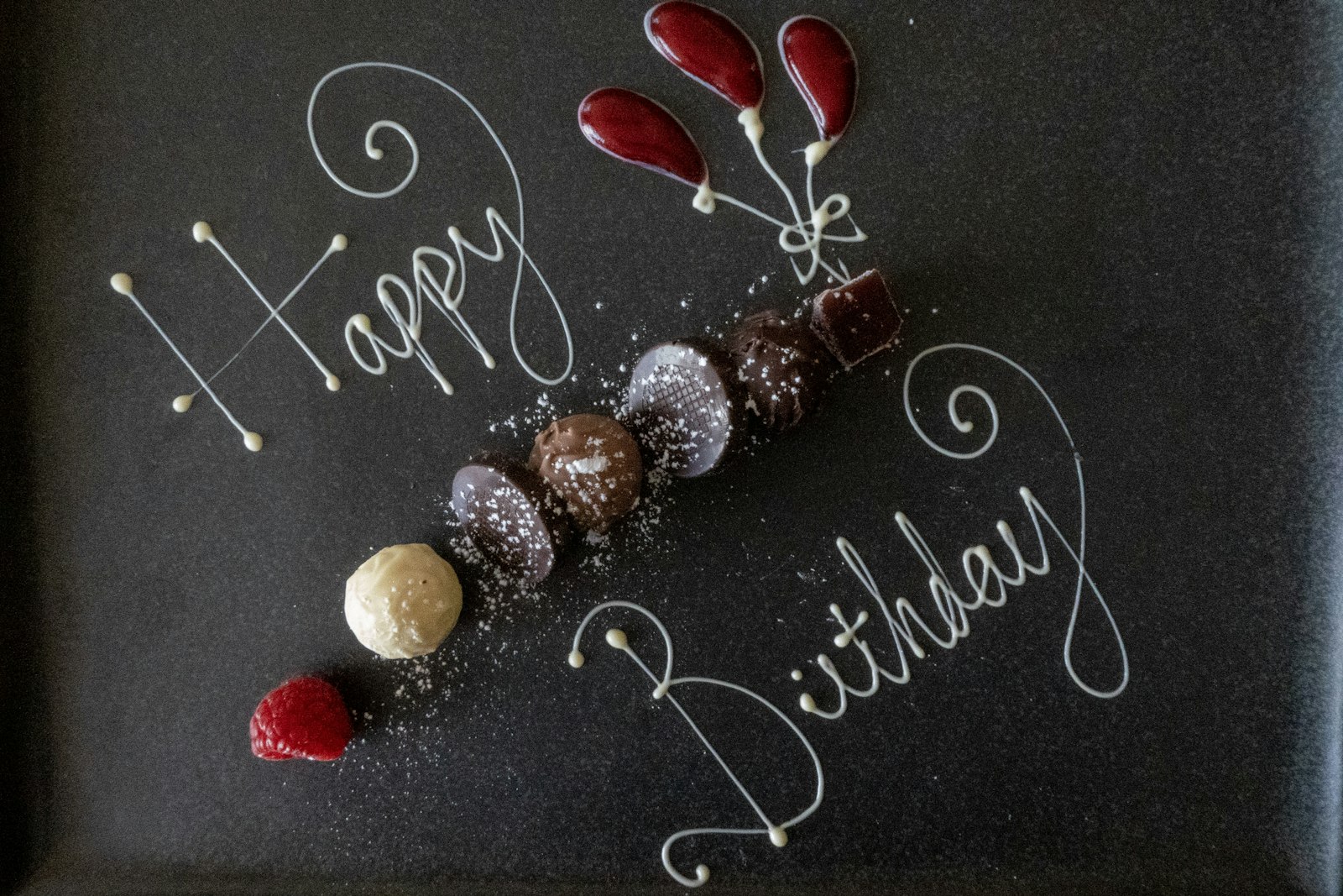 Birthday cake with lit candles and sparklers on a festive table